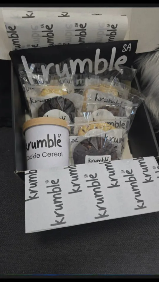 This box = pure cookie chaos (the good kind).

Whether you’re spoiling your parents, bribing a bestie, or just treating your own fabulous self — this gift box is packed with our life-changing cookies and our dangerously addictive cookie cereal.

Build your own, seal it with sweet intentions, and let Krumble do the talking. Nationwide delivery available – because joy deserves to travel.

#KrumbleSACookies #CookieGoals #GooeyGifts #CookieCerealCraze #BiteMeSweetly